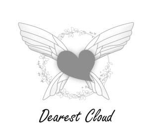 A gray heart with large, stylized white wings is centered over a delicate circular wreath of white leaves and branches on a black background.
