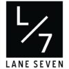 A black square logo with a white “L” and “7” separated by a diagonal slash, reflecting modern Portland fashion aesthetics. Below the square, the text reads “LANE SEVEN” in bold, uppercase letters.