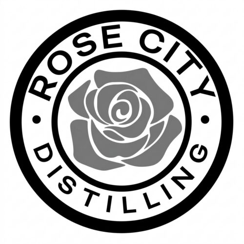 A circular logo with a stylized rose in the center evokes the spirit of Portland Fashion. The words “ROSE CITY DISTILLING” encircle the rose, separated by small dots.